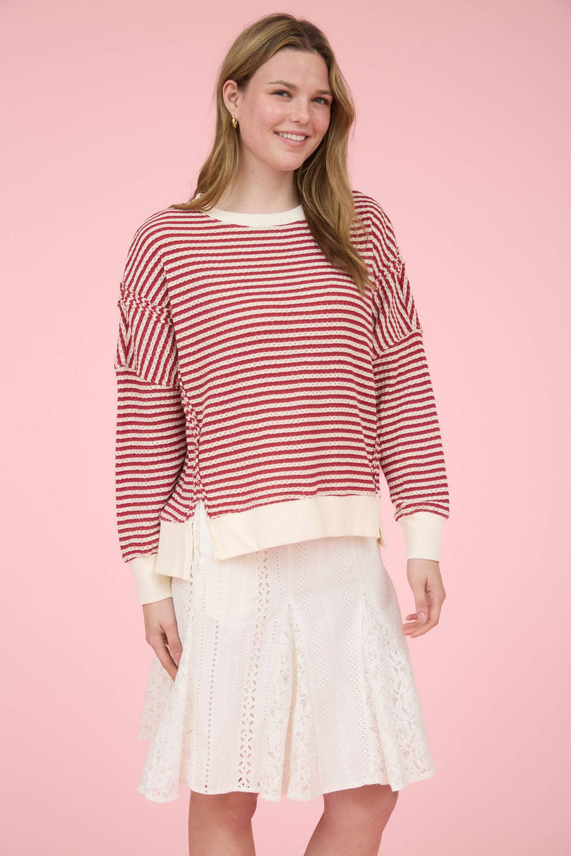 STRIPE EXPOSED SEAM SPLIT HEM LONG SLEEVE KNIT TOP: CREAM
