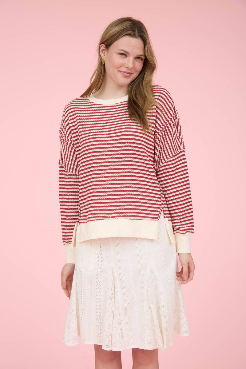 STRIPE EXPOSED SEAM SPLIT HEM LONG SLEEVE KNIT TOP: CREAM
